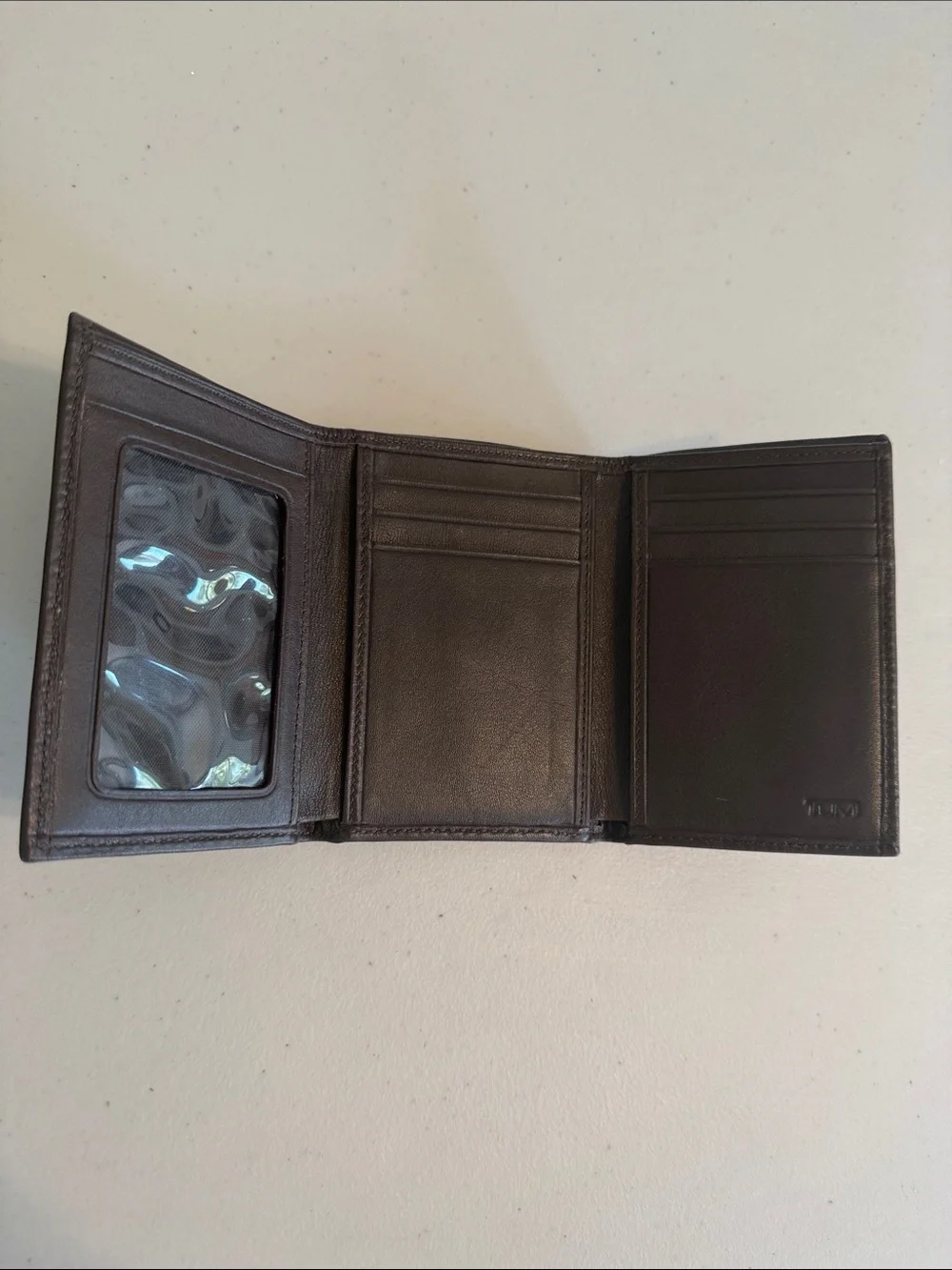 Tumi Brown Leather Tri-Fold Wallet with Red Logo Accent
